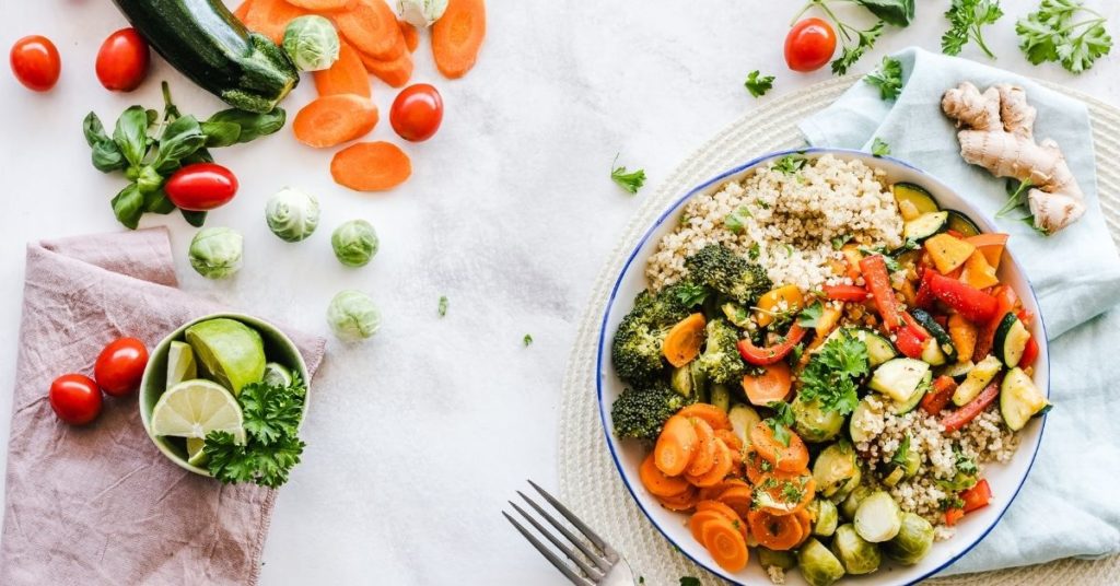 A Colorful Dish Filled with Diced Veggies Over Rice | Benefits of a Plant-Based Dietjpg