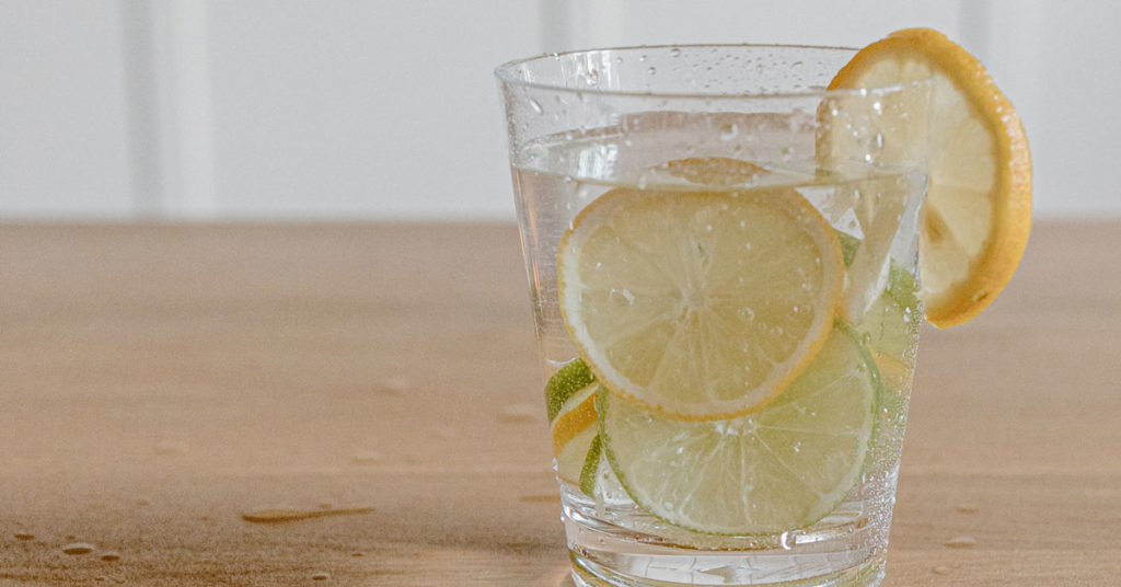 glass of water with lemon | strengthen your immune system with foods