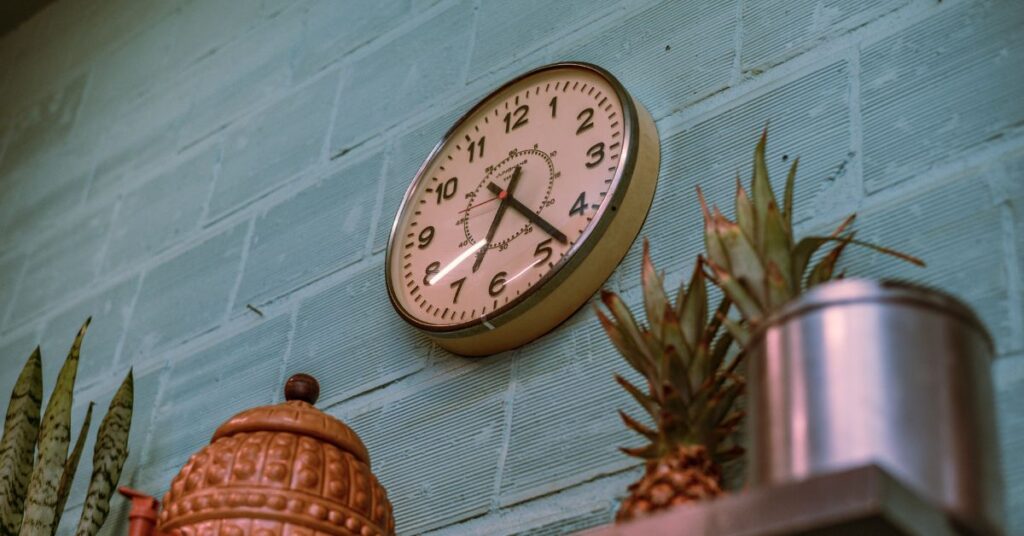 A clock on the wall in a kitchen