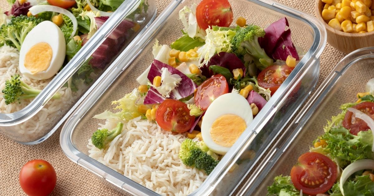 https://mynutritiondesign.com/wp-content/uploads/2023/07/Several-glass-containers-showing-meal-prep-of-rice-with-a-Mexican-inspired-salad-with-hard-boiled-eggs-portion-control-for-weight-loss.jpg