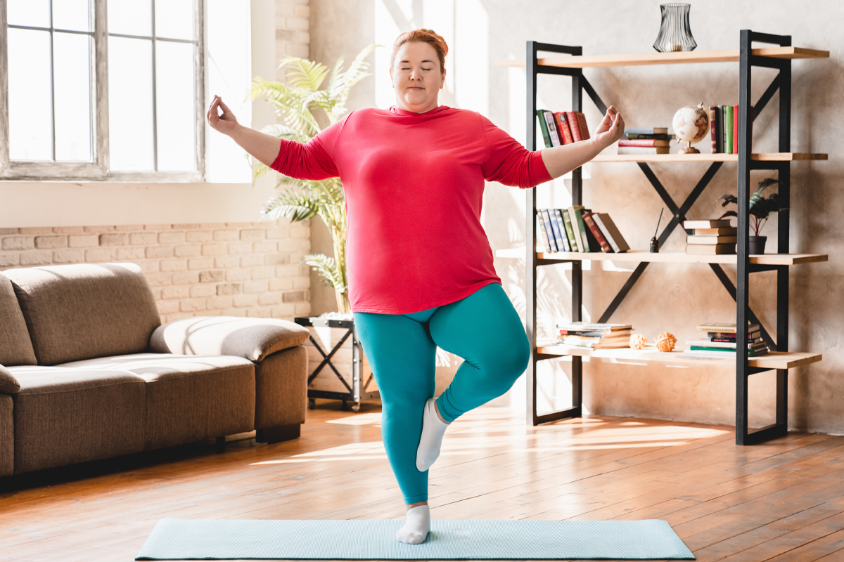 woman practicing Vinyasa Yoga