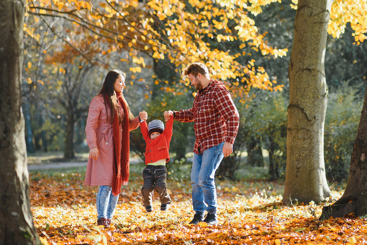 young family enjoying autumn weather