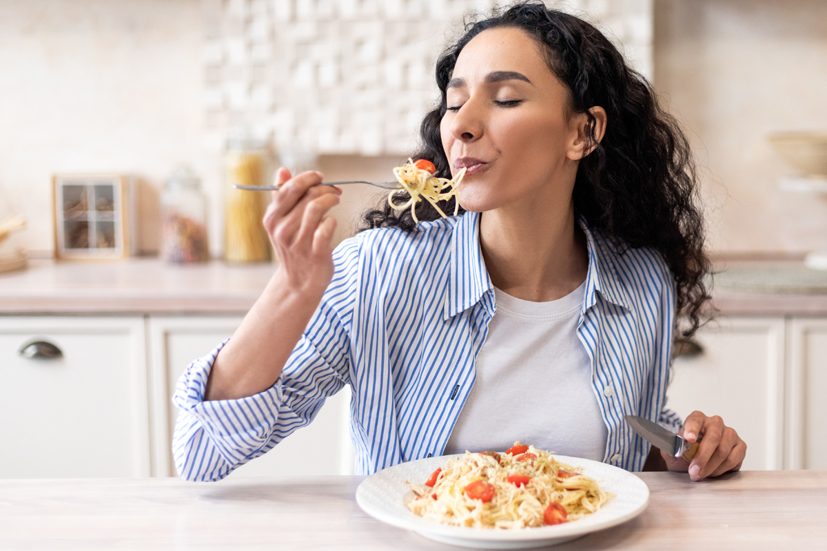 woman eating meal - mindful eating