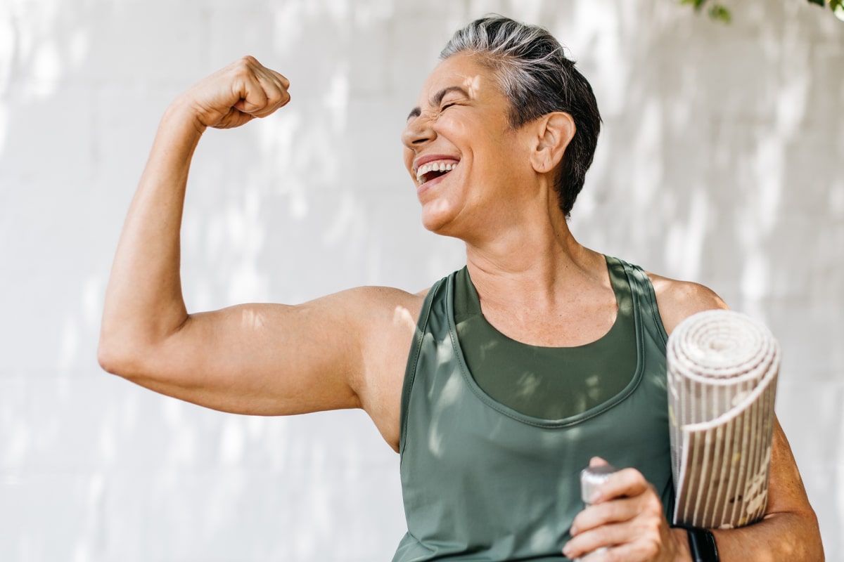 build muscle after glp-1 concept - woman flexing her bicept